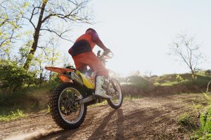 Man riding motorbike on motocross track.Extreme and Adrenaline. Motocross rider in action. Motocross sport. Active lifestyle