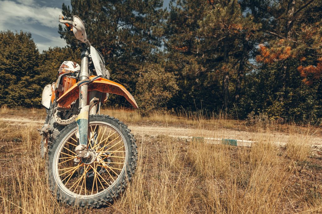 Orange enduro  Bike on a field of grass