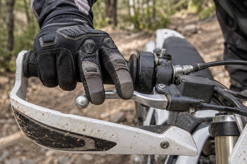 Enduro rider operating the clutch lever with two fingers